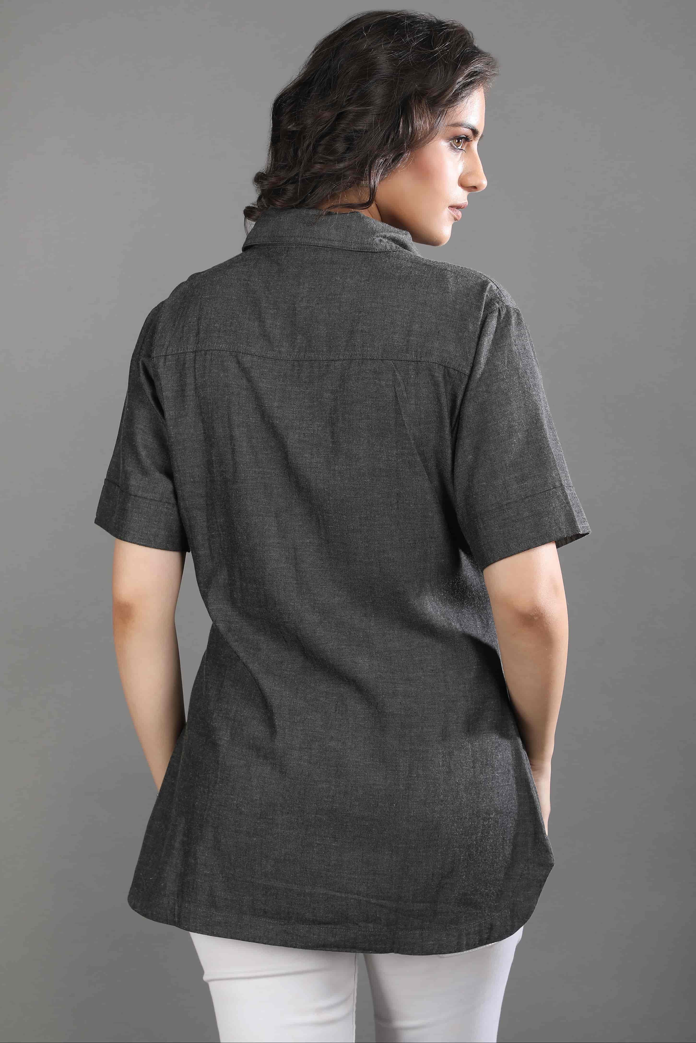 Back view of the Ash in Form denim shirt by Guilt & Class, showing the clean silhouette and washed grey-black tone.