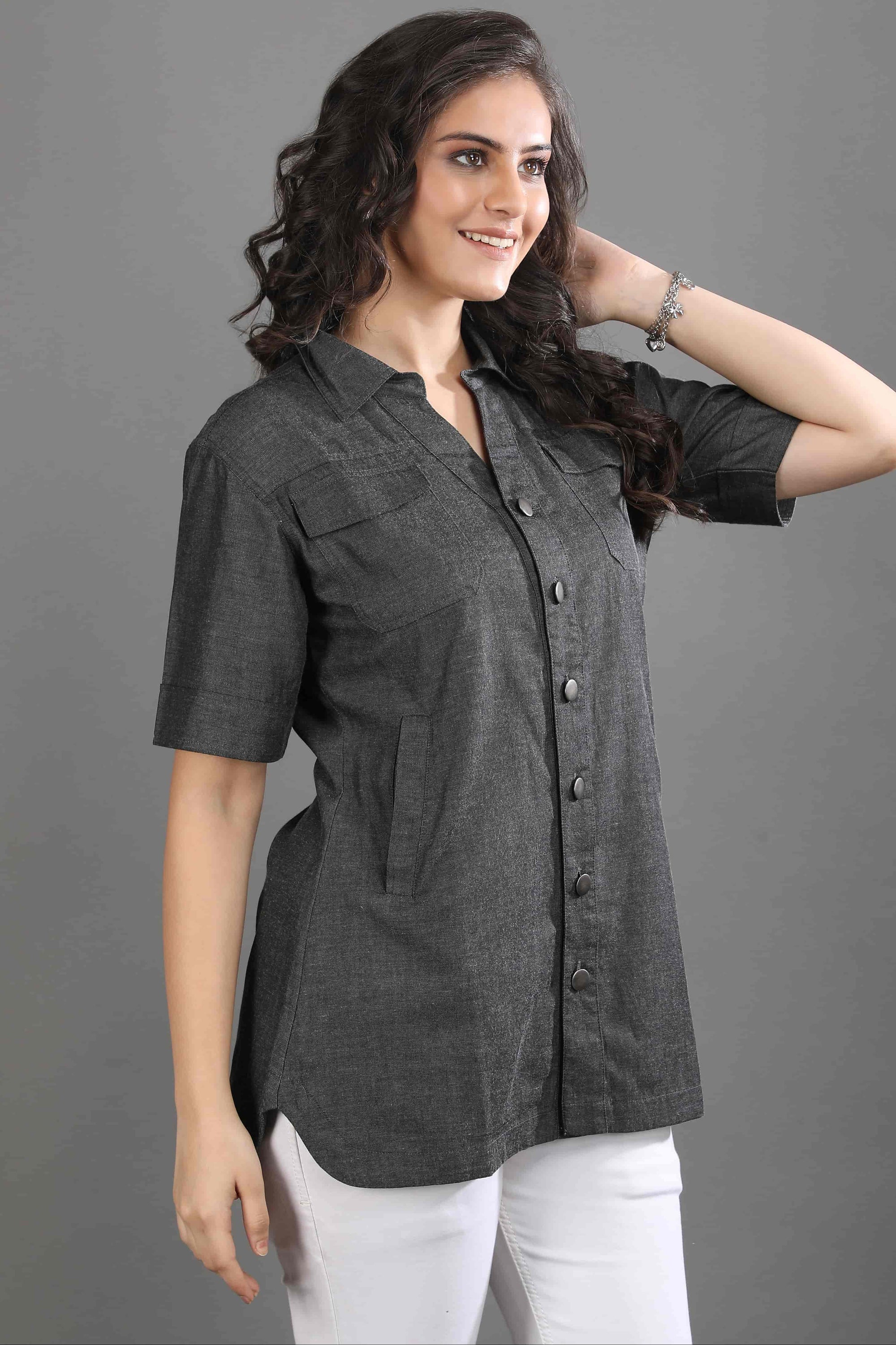 Side profile of the Ash in Form denim shirt by Guilt & Class, showcasing the easy fit and lightweight structure.