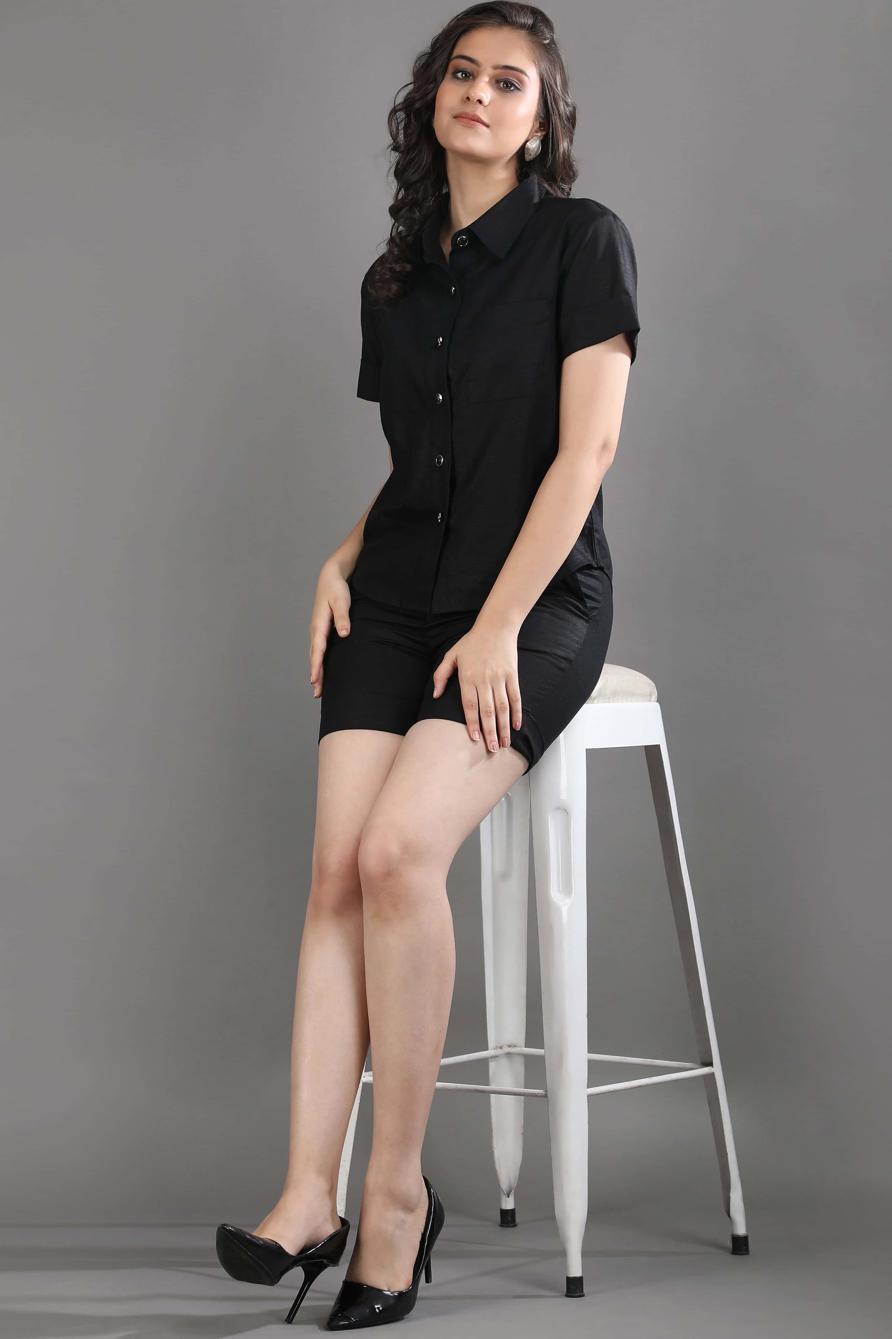 Seated view of the Midnight Theory co-ord set by Guilt & Class, highlighting its clean structure and effortless, polished silhouette.