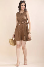 Full-length shot showing how to style the Mocha Mood dress for a casual luxury look, paired with transparent heels, sunglasses, and a woven bag.