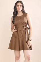 Front view of a woman wearing the premium Mocha Mood A-line dress by Guilt & Class, featuring functional front pockets and a cinched tie belt.