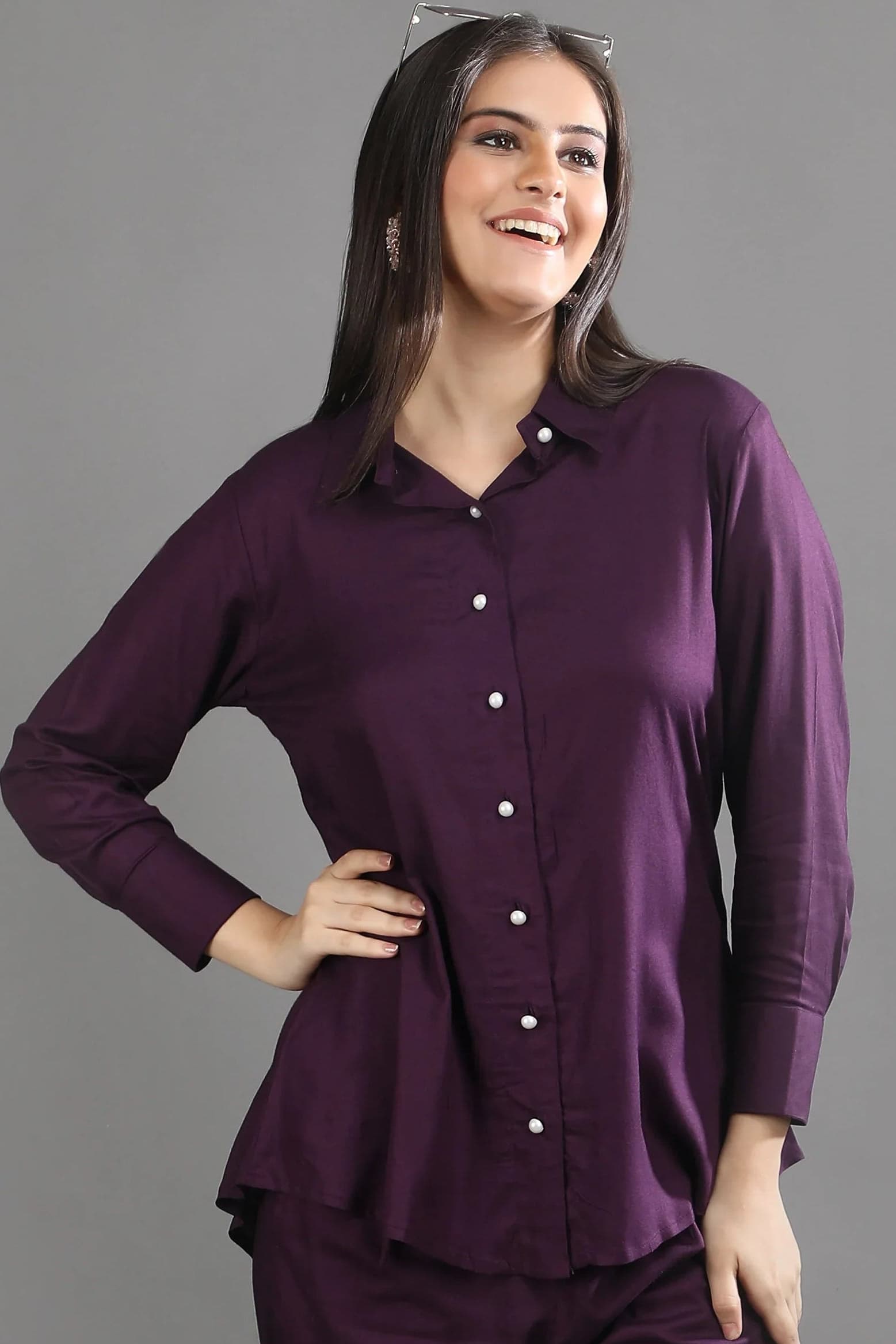 Half-length shot highlighting the collared neckline and comfortable drape of the mulberry purple co-ord shirt by Guilt & Class.