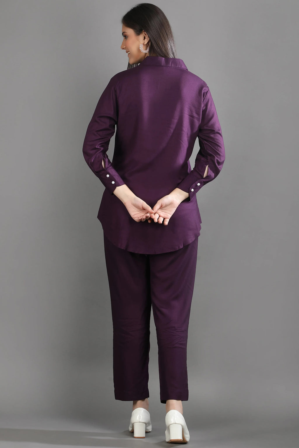 Back view of the mulberry purple matching set showing the relaxed fit of the tunic-style shirt and tailored trousers.