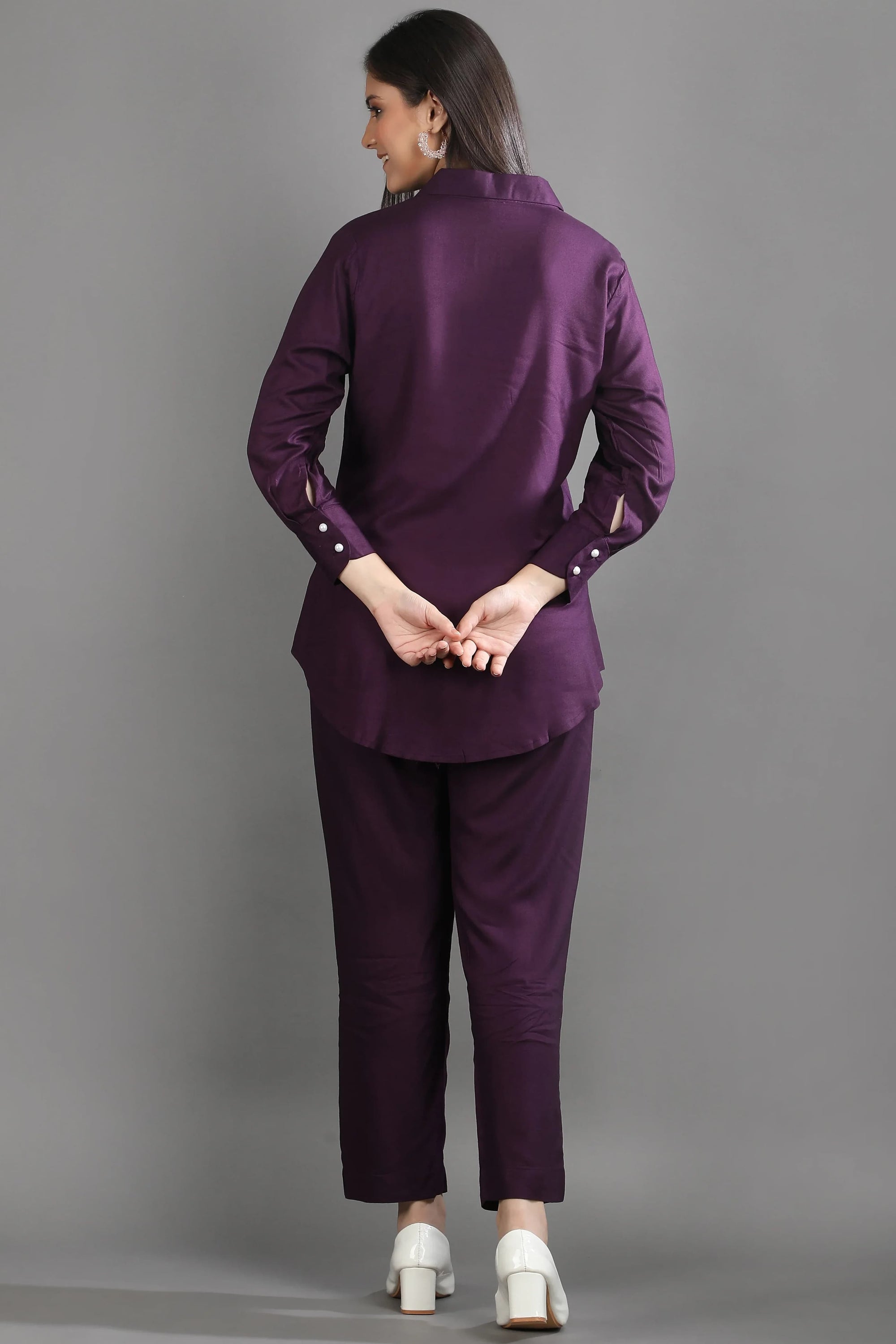 Back view of the mulberry purple matching set showing the relaxed fit of the tunic-style shirt and tailored trousers.