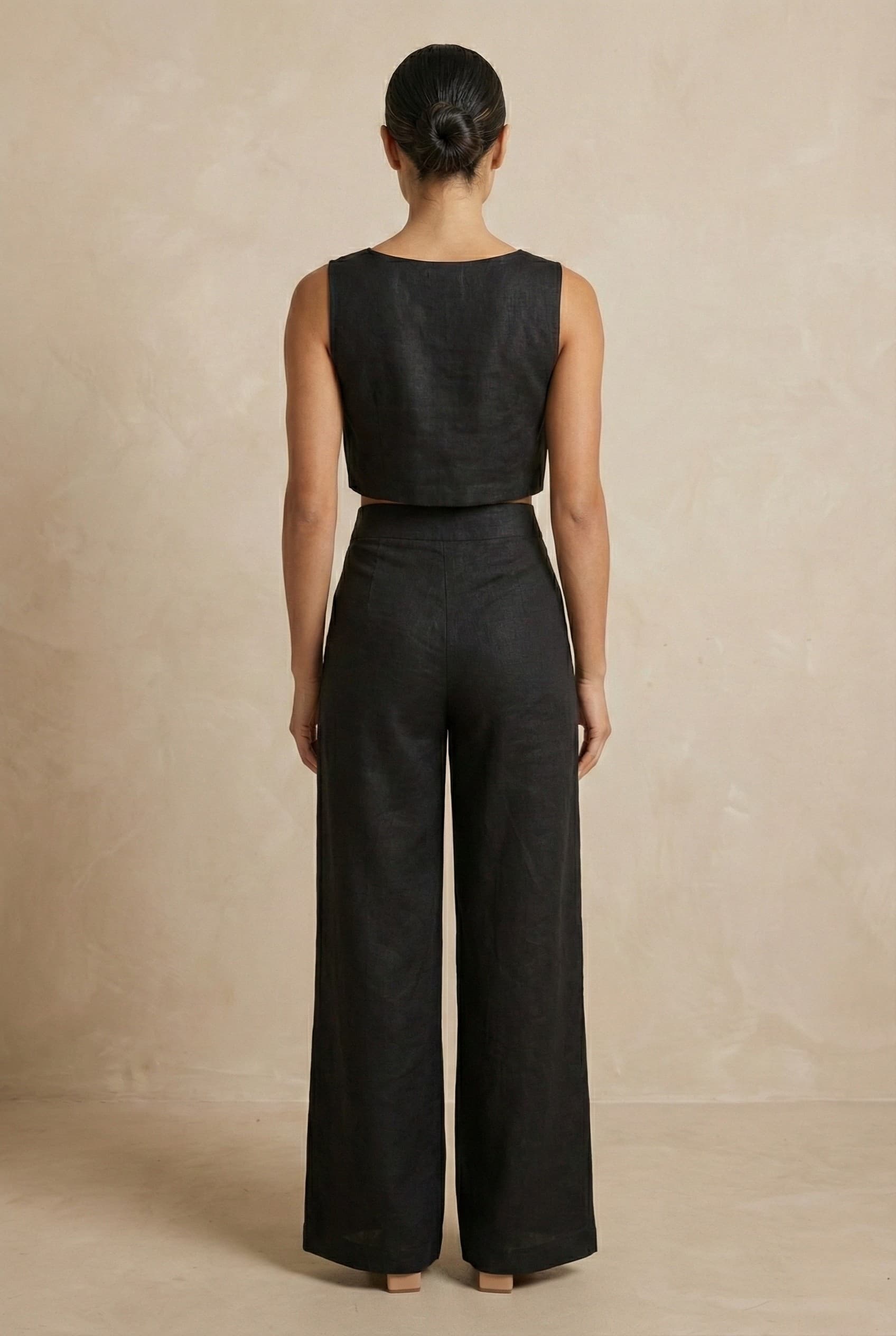 Back view of the Noir linen co-ord set by Guilt & Class, featuring a clean finish with concealed zipper closures.