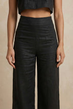 Close-up of the Noir linen co-ord trouser by Guilt & Class, highlighting the waistline and cotton-linen texture.
