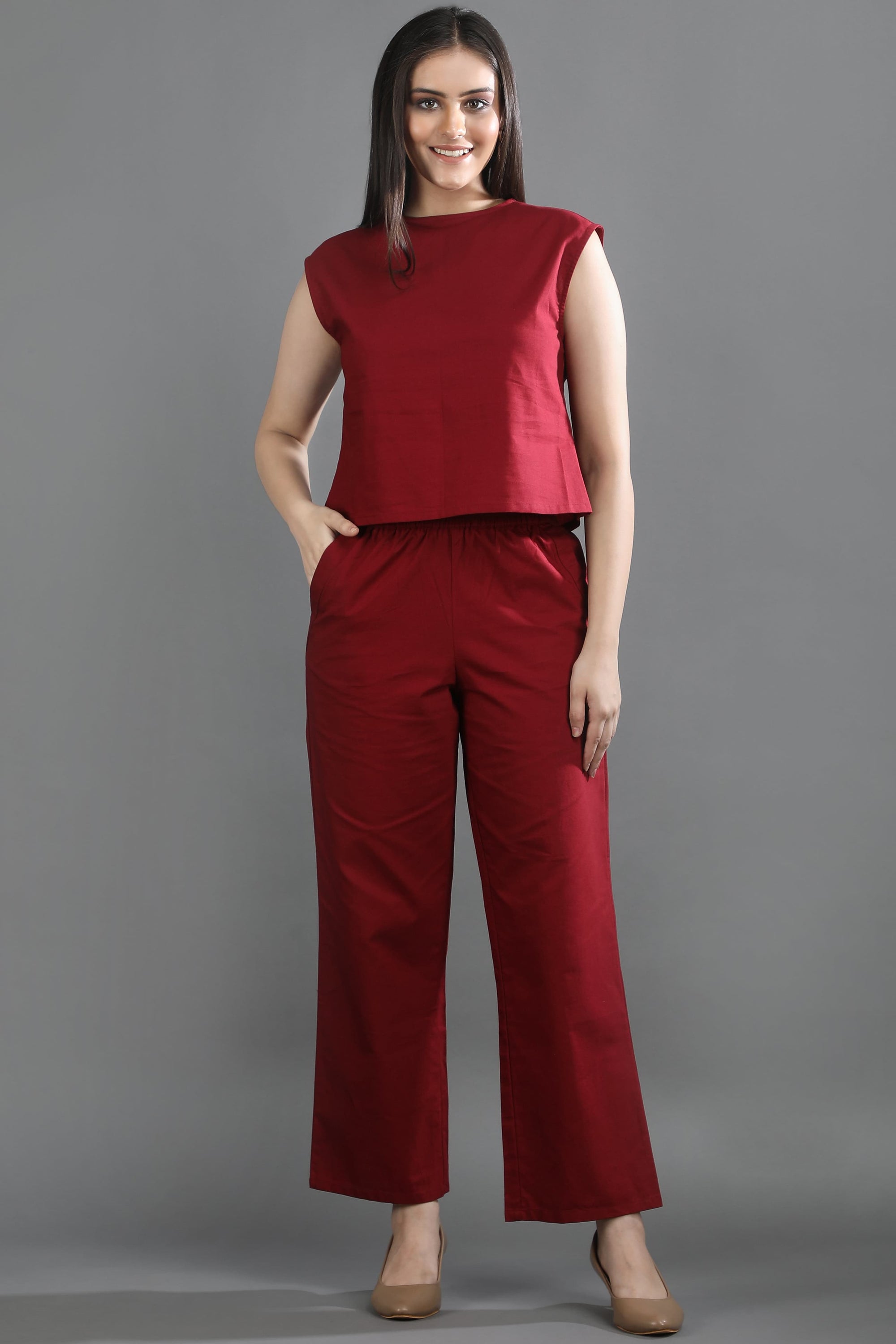 A model wearing the Oxford Ease co-ord set by Guilt & Class, featuring a relaxed Oxford cotton top with straight-fit trousers.