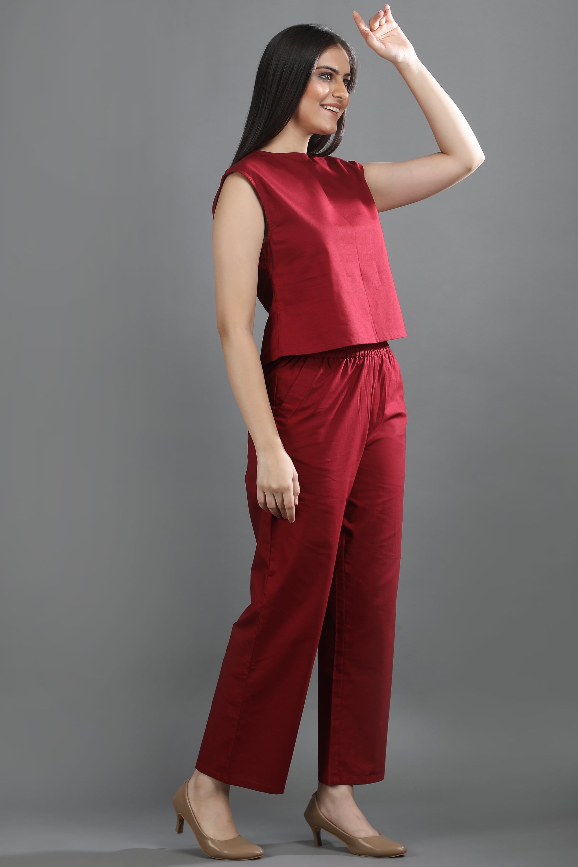 A model in motion wearing the Oxford Ease co-ord set by Guilt & Class, showing its relaxed fit and breathable Oxford cotton fabric.