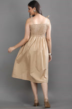 Back view of the Second Skin midi dress by Guilt & Class, featuring adjustable tie-up straps and a smocked bodice for a flexible fit.