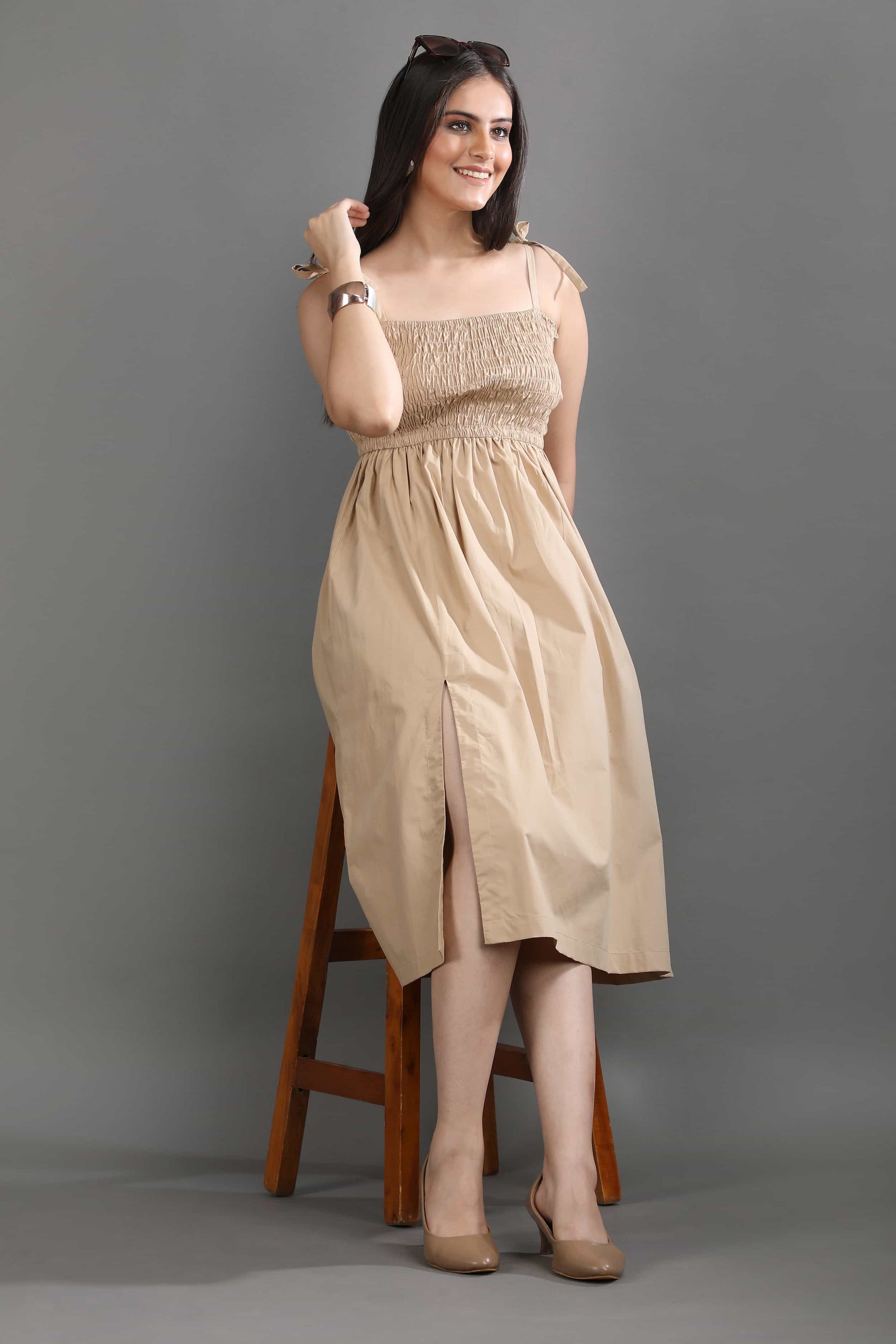 A model in motion wearing the Second Skin midi dress by Guilt & Class, highlighting its breathable fabric and easy, flowing movement.