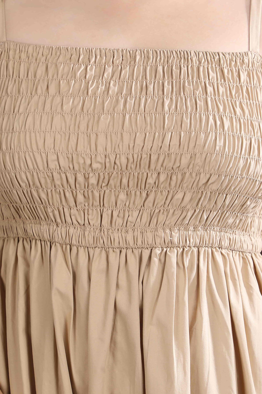 Close-up of the Second Skin midi dress by Guilt & Class, highlighting the smocked bodice and soft textured cotton fabric.