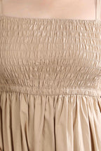 Close-up of the Second Skin midi dress by Guilt & Class, highlighting the smocked bodice and soft textured cotton fabric.