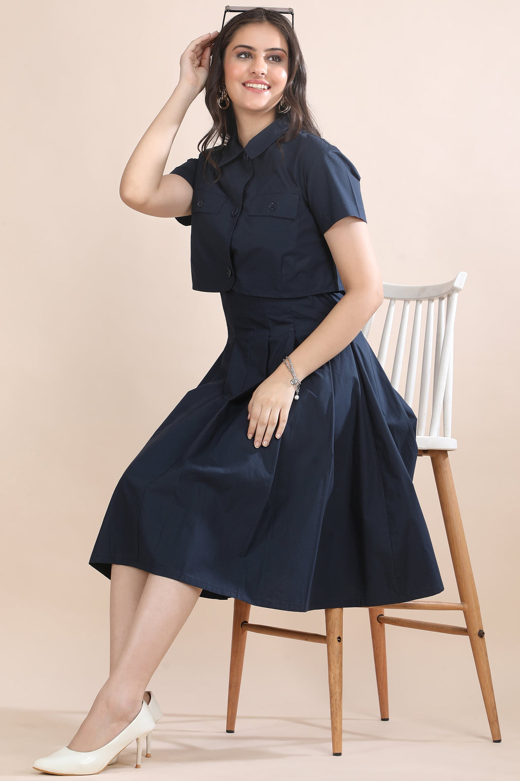 A model in motion wearing the Shape in Blue co-ord set by Guilt & Class, highlighting its structured silhouette and fluid movement.