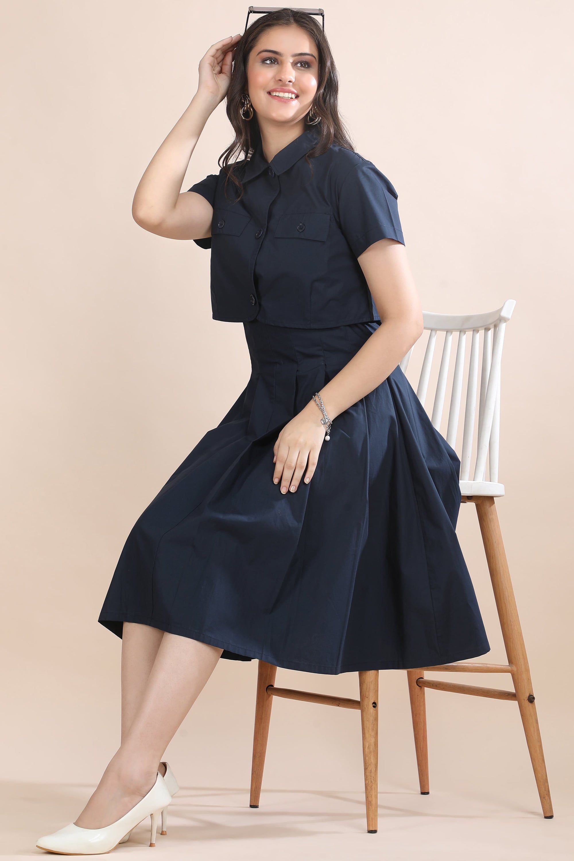 A model in motion wearing the Shape in Blue co-ord set by Guilt & Class, highlighting its structured silhouette and fluid movement.