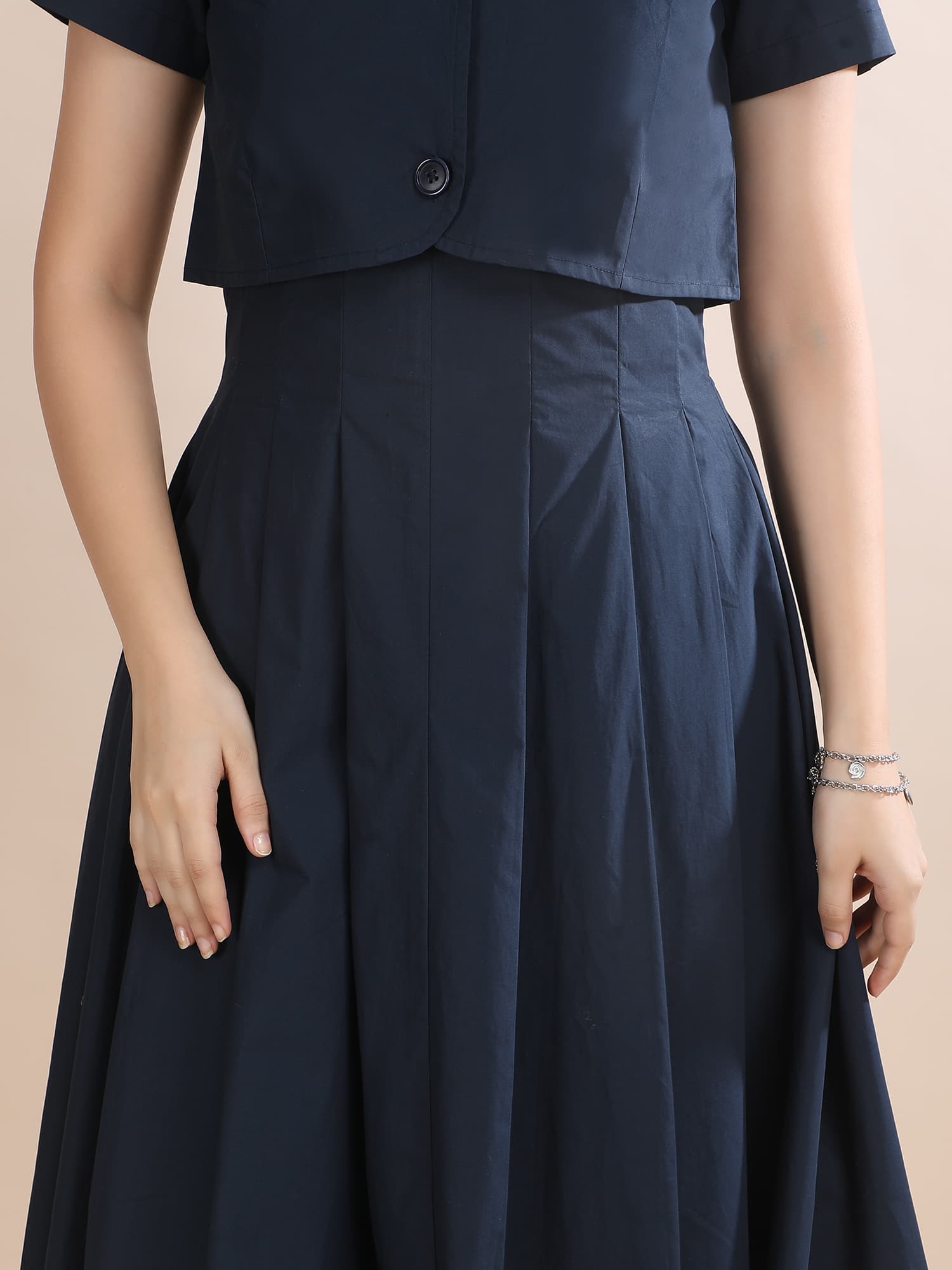 Close-up of the cropped overlay jacket in the Shape in Blue set by Guilt & Class, highlighting the structured cotton and collar detail.