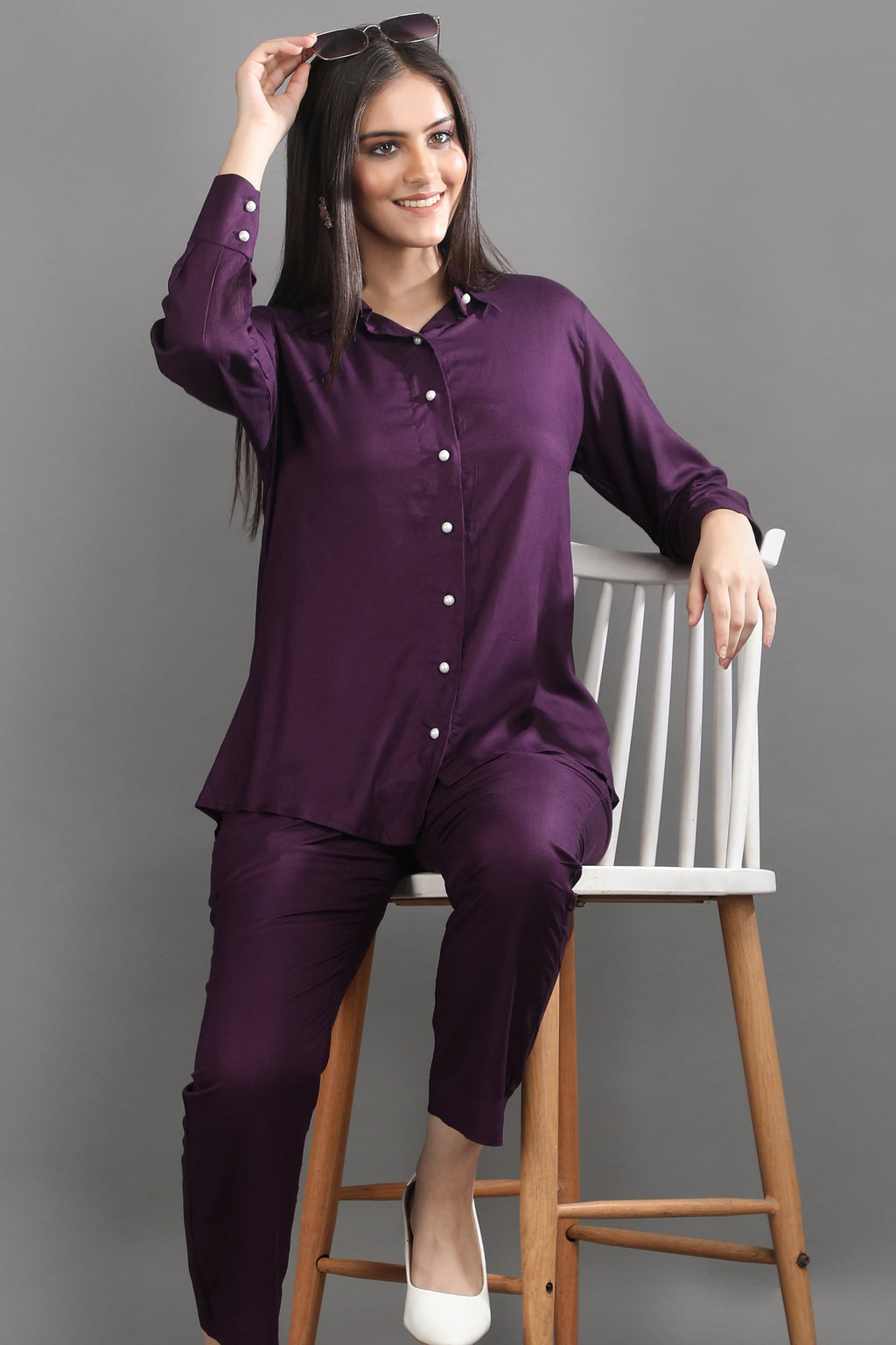 A woman styling the versatile mulberry co-ord set with sunglasses, demonstrating the perfect blend of comfort and quiet luxury.