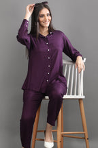 A woman styling the versatile mulberry co-ord set with sunglasses, demonstrating the perfect blend of comfort and quiet luxury.